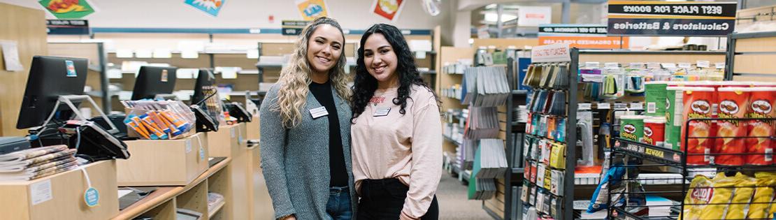 Two Pima students work in a Pima Bookstore