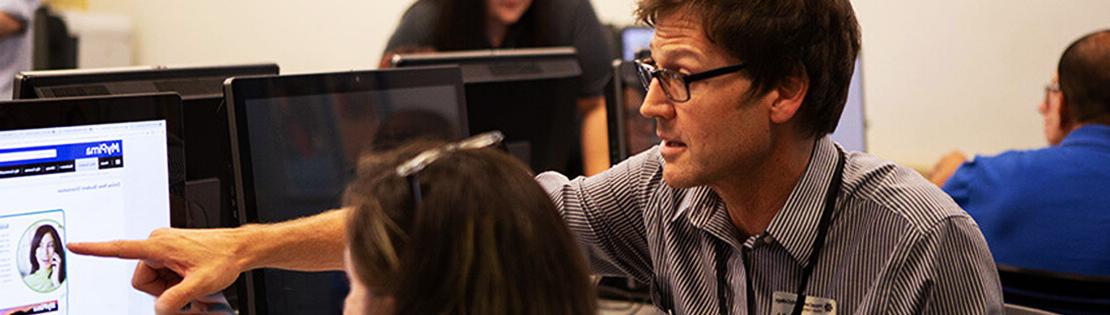 Student service center employee working with a student